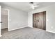 Neutral bedroom with a unique sliding closet door and a ceiling fan at 3389 W Barcelona Dr, Chandler, AZ 85226