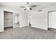 Spacious bedroom featuring plush carpeting, ample closet space, and a modern ceiling fan at 3389 W Barcelona Dr, Chandler, AZ 85226