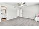 Bright bedroom shows a ceiling fan and entry to a bathroom at 3389 W Barcelona Dr, Chandler, AZ 85226
