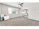 Spacious bedroom with mirrored closet doors, bright light, and a ceiling fan at 3389 W Barcelona Dr, Chandler, AZ 85226