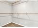 Walk-in closet with multiple wooden rods for ample storage and organization at 3389 W Barcelona Dr, Chandler, AZ 85226