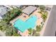 Aerial view of the community pool with sun loungers, shaded pavilion, and well-maintained landscaping at 3389 W Barcelona Dr, Chandler, AZ 85226