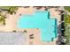 Overhead shot of a community pool with unique shape, featuring clear blue water and lounge seating on the deck at 3389 W Barcelona Dr, Chandler, AZ 85226