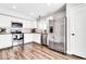 Modern kitchen with stainless steel appliances, granite counters, and white cabinets at 3389 W Barcelona Dr, Chandler, AZ 85226