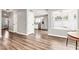 Bright living room showcasing beautiful wood floors and access to the kitchen at 3389 W Barcelona Dr, Chandler, AZ 85226