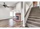 Cozy living room featuring a brick fireplace and a staircase at 3389 W Barcelona Dr, Chandler, AZ 85226