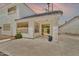 Outdoor patio features concrete flooring, sliding glass doors, and partial shade from the home's extended roofline at 3389 W Barcelona Dr, Chandler, AZ 85226