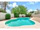 Inviting backyard pool surrounded by a patio and block fencing, perfect for outdoor enjoyment at 3389 W Barcelona Dr, Chandler, AZ 85226
