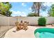 Inviting pool area with seating, perfect for entertaining or relaxing in the backyard at 3389 W Barcelona Dr, Chandler, AZ 85226