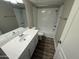 Updated bathroom featuring a vanity with sink, toilet and shower-tub combination at 3434 W Danbury Dr # A206, Phoenix, AZ 85053