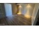 Inviting bedroom boasts wood floors, a bright window, and a cozy, comfortable atmosphere at 3434 W Danbury Dr # A206, Phoenix, AZ 85053