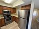 Modern kitchen featuring stainless steel appliances, granite countertops, and ample storage at 3434 W Danbury Dr # A206, Phoenix, AZ 85053