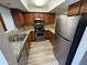 Modern kitchen featuring stainless steel appliances, granite countertops, and ample storage at 3434 W Danbury Dr # A206, Phoenix, AZ 85053