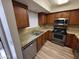 Modern kitchen featuring stainless steel appliances, granite countertops, and ample storage at 3434 W Danbury Dr # A206, Phoenix, AZ 85053