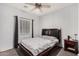 Cozy bedroom with a ceiling fan and a window allowing natural light at 3685 N 141St Dr, Goodyear, AZ 85395