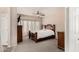 Spacious main bedroom with neutral tones, a ceiling fan, and large windows for ample natural light at 3685 N 141St Dr, Goodyear, AZ 85395