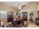 Traditional dining room has vaulted ceiling, patterned rug, and a table with chairs at 4136 E Greenway Cir, Mesa, AZ 85205
