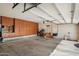 Spacious garage with built-in cabinets provides ample storage space for tools and equipment at 4136 E Greenway Cir, Mesa, AZ 85205