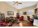 Cozy living room featuring vaulted ceiling, plush seating, and a decorative rug at 4136 E Greenway Cir, Mesa, AZ 85205