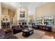 Bright living room boasts vaulted ceilings, a cozy fireplace, and an open floor plan at 4136 E Greenway Cir, Mesa, AZ 85205