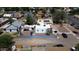 An aerial shot featuring a property with a red roof and neutral exterior, set within a bustling neighborhood at 42 E 2Nd Ave, Mesa, AZ 85210