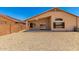 Low-maintenance backyard with a rockscape and covered patio, perfect for outdoor living at 42196 W Chisholm Dr, Maricopa, AZ 85138