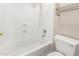 Bright bathroom featuring a white shower-tub combination and neutral-colored walls at 42196 W Chisholm Dr, Maricopa, AZ 85138