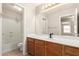 Bathroom featuring tile floors, white vanity, and combined tub and shower at 42196 W Chisholm Dr, Maricopa, AZ 85138