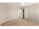 Bedroom featuring carpet floors, ceiling fan, closet, and interior door at 42196 W Chisholm Dr, Maricopa, AZ 85138