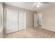 Bedroom featuring carpet floors, ceiling fan, closet, and interior door at 42196 W Chisholm Dr, Maricopa, AZ 85138