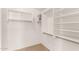 Bright walk-in closet with built-in shelves and ample storage space at 42196 W Chisholm Dr, Maricopa, AZ 85138