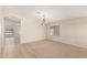 Dining room featuring tile entry, neutral carpet and large window at 42196 W Chisholm Dr, Maricopa, AZ 85138