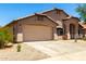 Charming single-story home with a two-car garage and desert landscaping at 42196 W Chisholm Dr, Maricopa, AZ 85138
