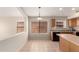Kitchen nook is illuminated by two windows and features tile flooring and light-colored wood cabinets at 42196 W Chisholm Dr, Maricopa, AZ 85138