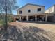 Large backyard featuring a covered patio, perfect for outdoor entertaining and relaxation at 43418 W Wild Horse Trl, Maricopa, AZ 85138
