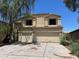Spacious two-story home with a three-car garage and desert landscaping in a desirable neighborhood at 43418 W Wild Horse Trl, Maricopa, AZ 85138