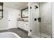 Stylish bathroom featuring a glass-enclosed shower, vanity with white cabinets, and modern fixtures at 4434 E Camelback Rd # 132, Phoenix, AZ 85018