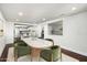 Dining room with a marble-top table next to a kitchen with white cabinets at 4434 E Camelback Rd # 132, Phoenix, AZ 85018