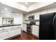Bright kitchen featuring granite countertops, white cabinets, and modern stainless-steel appliances at 4434 E Camelback Rd # 132, Phoenix, AZ 85018