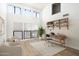 Cozy living room featuring built-in shelves and a stylish desk at 4434 E Camelback Rd # 132, Phoenix, AZ 85018