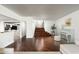 Spacious living room with hardwood floors, grand staircase, and piano at 4434 E Camelback Rd # 132, Phoenix, AZ 85018