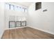 Open-concept living area featuring high ceilings, skylights, and sleek wood floors at 4434 E Camelback Rd # 132, Phoenix, AZ 85018
