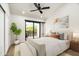 Bright main bedroom featuring sliding glass doors to the outside and neutral toned decor at 4434 E Camelback Rd # 132, Phoenix, AZ 85018