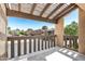 A covered outdoor patio area with wooden rails at 4434 E Camelback Rd # 132, Phoenix, AZ 85018
