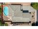 Top-down aerial view of a home with a pool, patio, desert landscaping, and parking at 45113 W Buckhorn Trl, Maricopa, AZ 85139