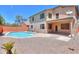 Beautiful backyard featuring a refreshing pool with ample space for lounging and outdoor entertaining at 45113 W Buckhorn Trl, Maricopa, AZ 85139