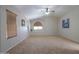 Bright, open bedroom with vaulted ceilings, carpet, and large windows at 45113 W Buckhorn Trl, Maricopa, AZ 85139