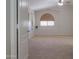 A bright bedroom with vaulted ceiling, and carpeted floor at 45113 W Buckhorn Trl, Maricopa, AZ 85139