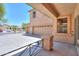 Spacious three-car garage, visible from the shaded, covered patio, offering a relaxing outdoor space at 45113 W Buckhorn Trl, Maricopa, AZ 85139
