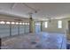 Spacious three car garage with two automatic doors and space for storage at 45113 W Buckhorn Trl, Maricopa, AZ 85139